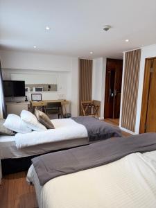 Letto o letti in una camera di Hotel Astra