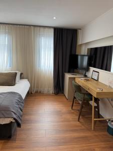 Letto o letti in una camera di Hotel Astra