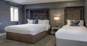 Cama ou camas em um quarto em The Lord Street Hotel; BW Signature Collection