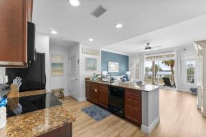 a kitchen with a sink and a counter top at Reflections 307 in Panama City Beach