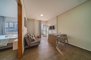 a bedroom with a bed and a desk in a room at Primus House in São Paulo +105 photos