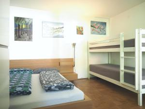 Ein Bett oder Betten in einem Zimmer der Unterkunft Künstlerhaus Arthotel
