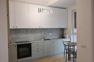 Kuchyň nebo kuchyňský kout v ubytování Bizz Apartment