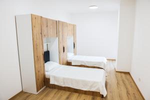 Postel nebo postele na pokoji v ubytování Bizz Apartment