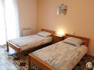 Posteľ alebo postele v izbe v ubytovaní La paraguere