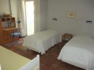 Una cama o camas en una habitación de villa cassis vue mer