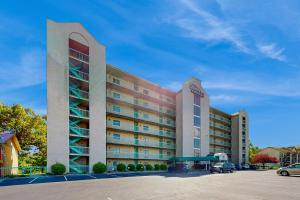 a large building with a parking lot in front of it at Rivers Edge Condo 206 in Pigeon Forge