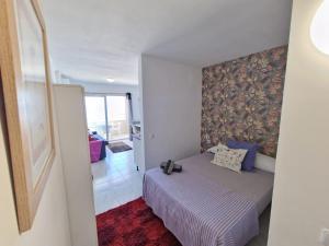 Posteľ alebo postele v izbe v ubytovaní APARTAMENTO BLUE SEA