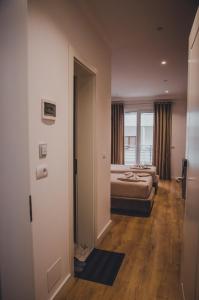 Postel nebo postele na pokoji v ubytování Hotel ERALD