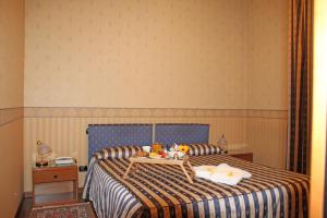 Posteľ alebo postele v izbe v ubytovaní Albergo Ristorante Leon d'Oro
