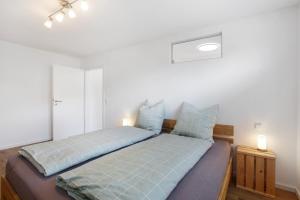 Postel nebo postele na pokoji v ubytování Schwarzwald Apartment