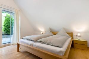 Postel nebo postele na pokoji v ubytování Landeckhof