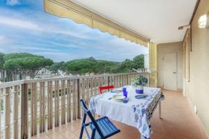 a table and chairs on a balcony with a view at Lido di Spina vista mare pineta - A Casa di Alessandra in Lido di Spina