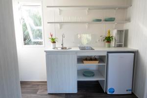 a kitchen with a sink and a counter at Bungalow Safari 2 in Tarifa