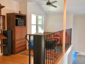 a living room with a staircase with a chair at Magical property in the Alabama Hills - HOT TUB in Lone Pine