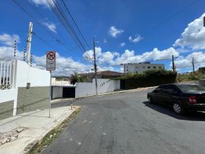 a car parked on the side of a street at Green Suíte Comfort in Garanhuns