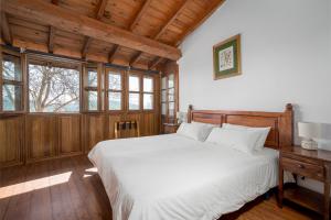 Ένα ή περισσότερα κρεβάτια σε δωμάτιο στο Casitas Arcenoyu