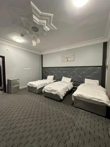 Ένα ή περισσότερα κρεβάτια σε δωμάτιο στο Al Ghazali Suites, اجنحة الغزالي للشقق المفروشه +39 φωτογραφίες