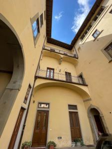 an external view of a building with a balcony at Palazzo Cellesi in Pistoia