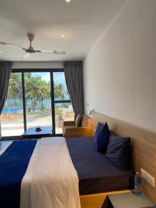 Postel nebo postele na pokoji v ubytování Tills Beach Resort + 47 fotografií