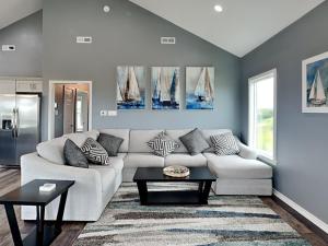 a living room with a couch and a table at Fish Tales in Lamar