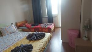 a bedroom with two beds with bows on them at Константин Иречек10 in Ruse