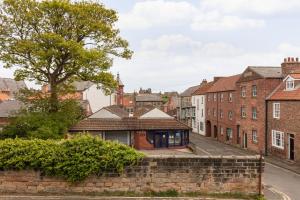 a house in a city with buildings at Discovery House in Whitby +22 photos