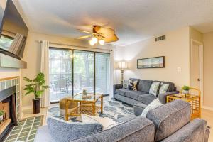 a living room with a couch and a fireplace at Private Deck & Pool Access: Myrtle Beach Getaway! in Myrtle Beach