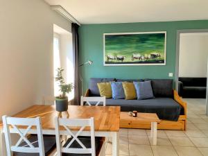 a living room with a couch and a table at Casa Gialla in Russo