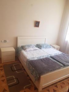 Postel nebo postele na pokoji v ubytování HOTEL Shaumiani