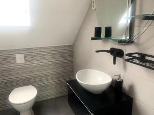 Kúpeľňa v ubytovaní Flair Apartmanház