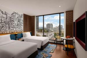 Hotel Indigo Saigon the City by IHG客房内的一张或多张床位