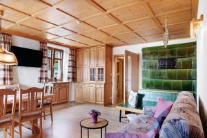 a living room with a couch and a table at Ferienwohnung Haus Brunner in Grafenhausen