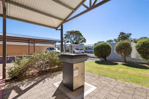 a trash can sitting on a sidewalk under a building at Comfort & Convenience - A Sepal Stay in Perth