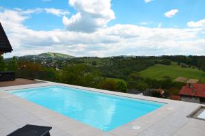 a swimming pool on top of a house at Skalna Osada in Istebna