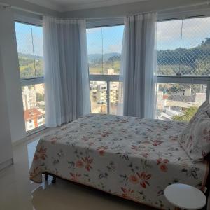 Ένα ή περισσότερα κρεβάτια σε δωμάτιο στο Ap 503 Ed Brisa do sol em Piratuba