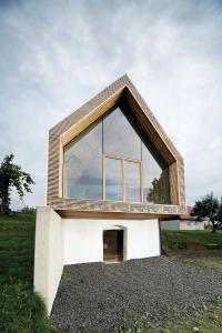 a house with a large window on top of a pile of gravel at Landloft in Sausal