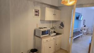 Η κουζίνα ή μικρή κουζίνα στο Teos Sunset View Apartment