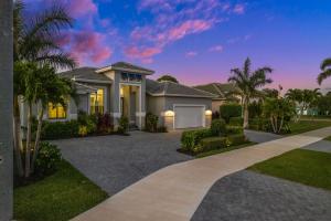 a home with a driveway in front of a house at Casa Palma - 5 Min to Beach, Heated Pool, Hot Tub, New Build in Marco Island