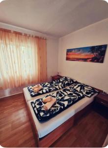 Posteľ alebo postele v izbe v ubytovaní Apartman Viki