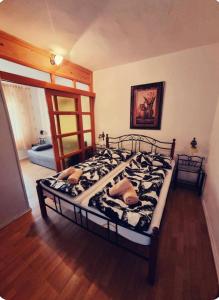 Posteľ alebo postele v izbe v ubytovaní Apartman Viki