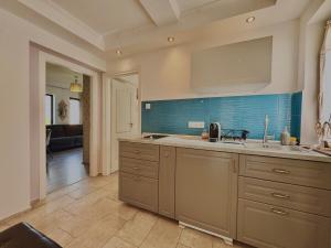 a kitchen with a sink and a counter top at Azur Villa - Panoramic Escape in Balatonalmádi +67 photos