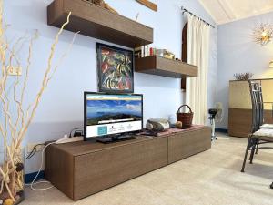 TV a/nebo společenská místnost v ubytování Villetta Redinoce - ArgonautiVacanze