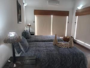 Ένα ή περισσότερα κρεβάτια σε δωμάτιο στο Zebula private villa 206