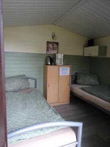 Postel nebo postele na pokoji v ubytování Campingplatz Blauer See