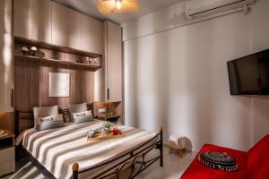 Postel nebo postele na pokoji v ubytování Natasha's Studio Apartment + 13 fotografií