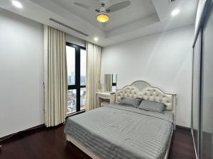 a bedroom with a large bed and a window at Royal City Apartment Ha Noi by Luxe Hospitality in Hanoi +42 photos