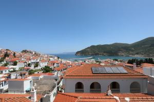 a view of a town with red roofs at Home Sweet Home in Skopelos Town