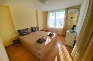 Postel nebo postele na pokoji v ubytování Hotel Bobchev