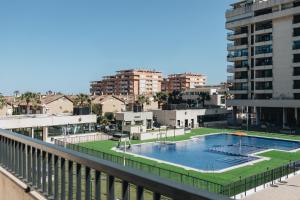 a swimming pool on the balcony of a building at White Beach Apartment in Valencia